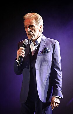 Valli singing onstage