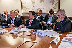 Okamoto (center), in his capacity as acting Assistant Secretary for International Finance and Development, at a board meeting of the Millennium Challenge Corporation in 2019