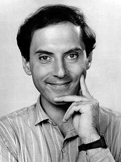 Black-and-white head shot of Castellaneta smiling