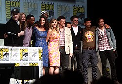 A group of actors and filmmakers attending a convention.